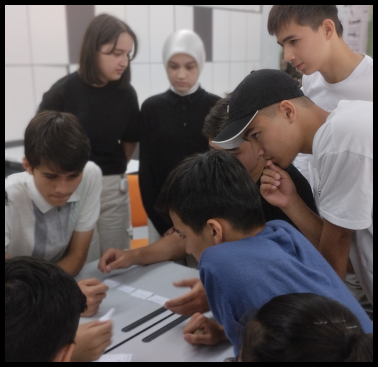 People collaborating closely over a task or project